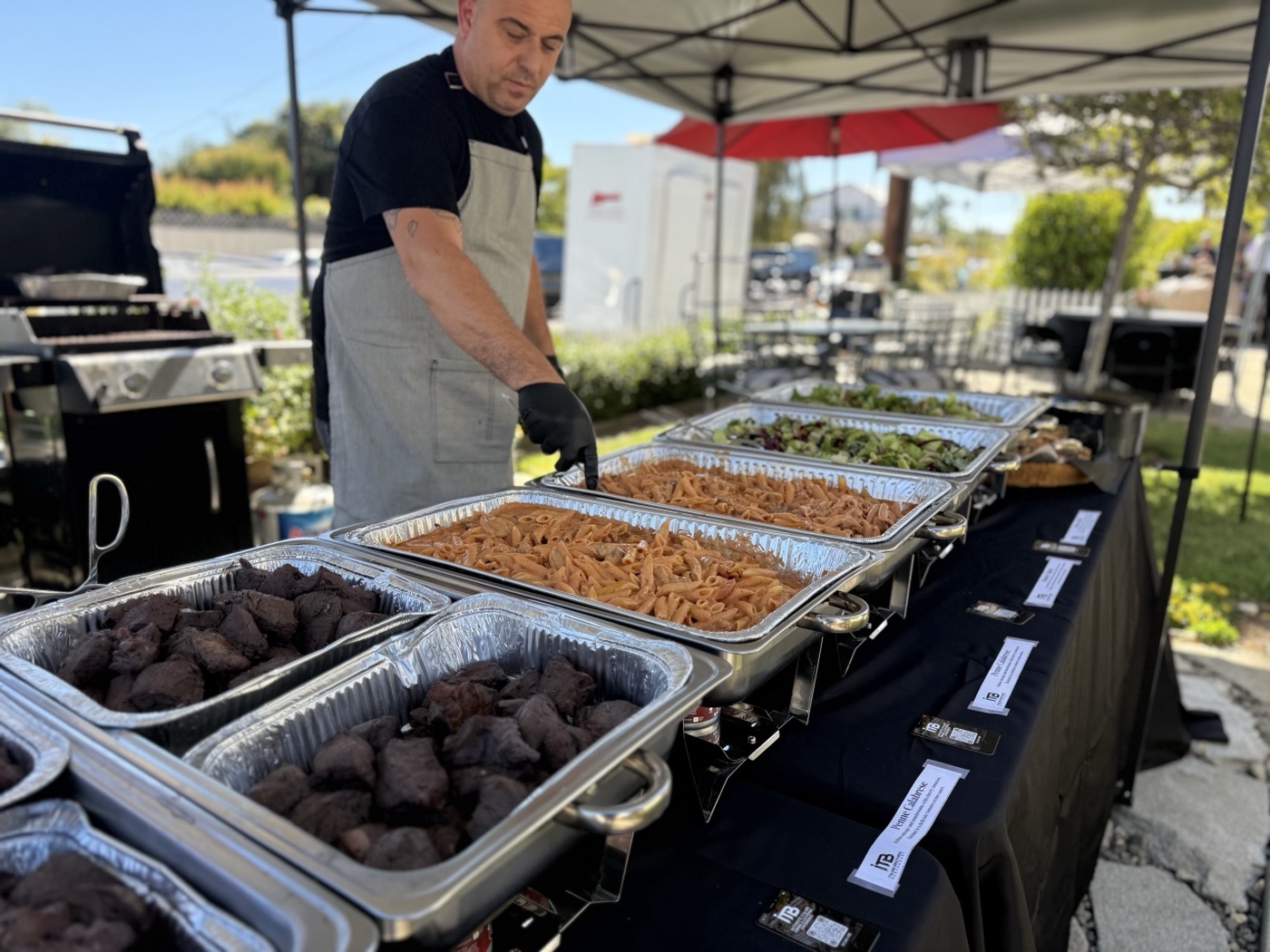 Italian Brothers team serving an outdoor Italian buffet